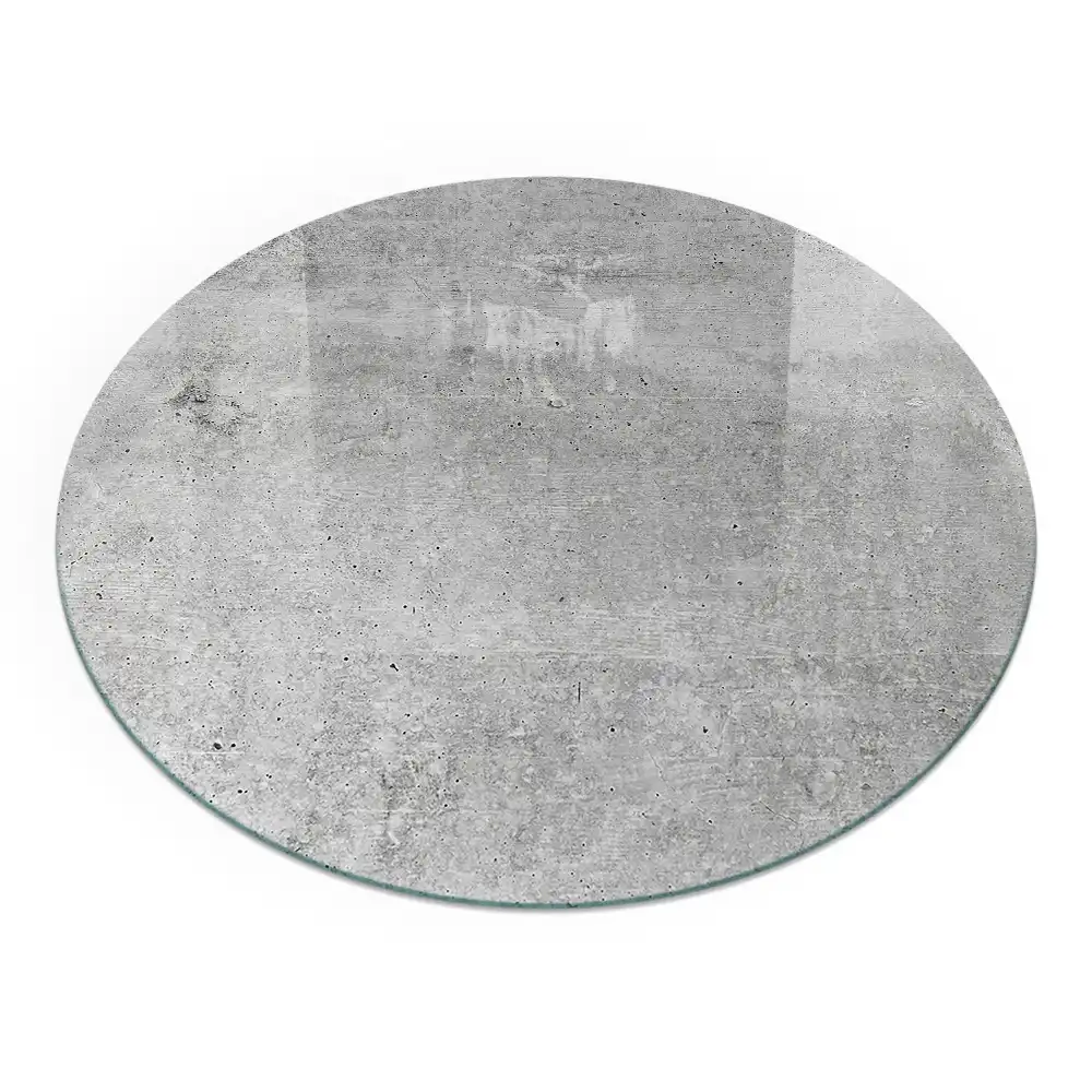 Kerek, minimalista stílusú, nyers beton kandalló üveg alátét